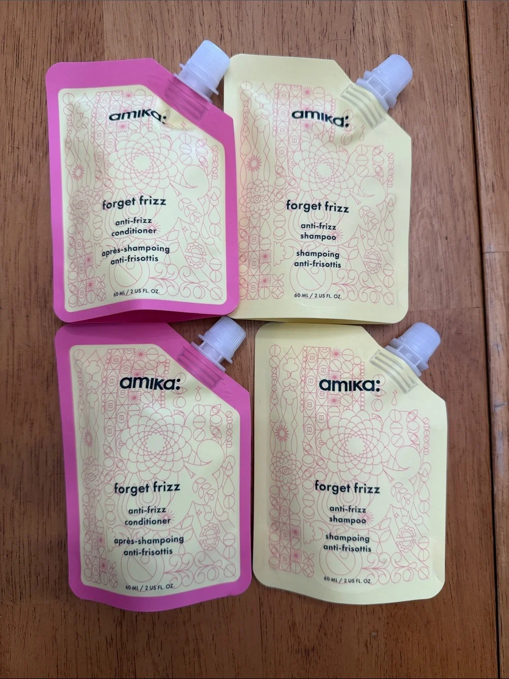 amika Forget Frizz Anti‑Frizz Shampoo & Conditioner travel sizes